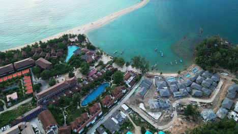 aerial waterfront resort in ko pha ngan or koh phangan island in gulf of thailand , koh nang yuan white sand beach drone top down view
