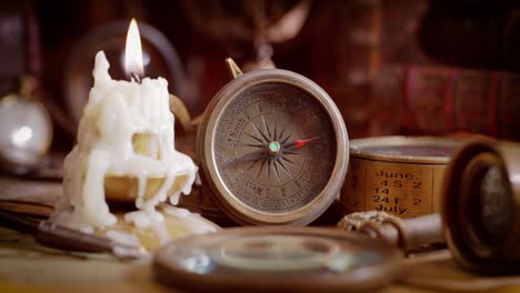 vintage style travel and adventure. vintage old compass and other vintage items on the table.