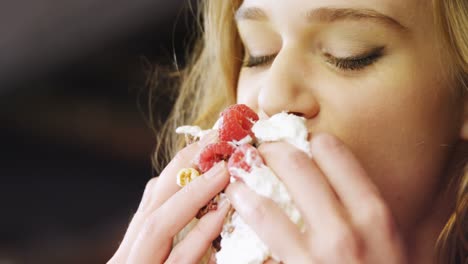 woman having cake in cafe 4k