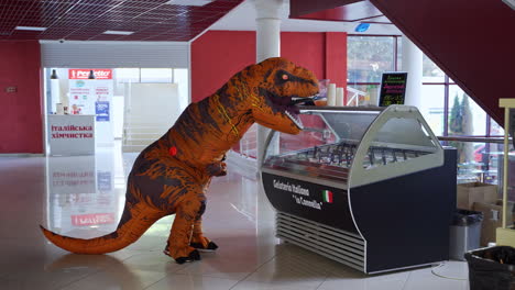 a t-rex costume in a shopping mall