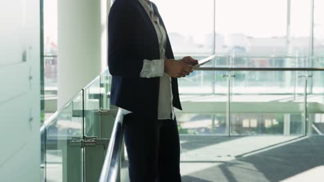 businesswoman using tablet in modern office building