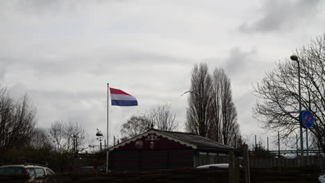 Dutch-flag-blowing-in-the-wind-in-Amsterdam