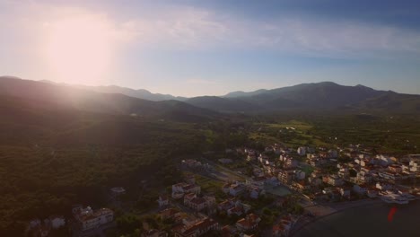 aerial: a small fishing village on samos during sunset