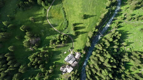 cascate del rutor surrounded by lush green forest and river, aerial view