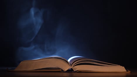 open book with mystic smoke