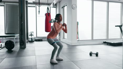 Woman,-resistance-band-or-squat-exercise