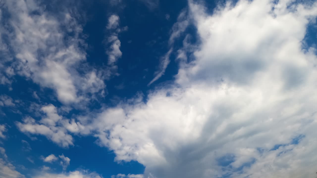 Clouds moving in timelapse. Vibrant clouds drift and change formation in a dynamic timelapse, showcasing the beauty of the open sky