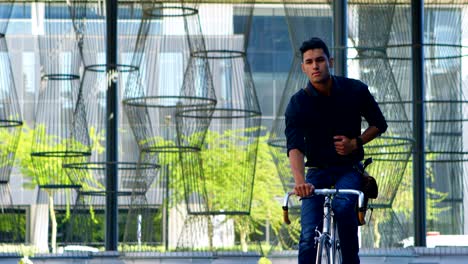 male commuter riding bicycle on street 4k