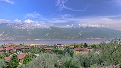 timelapse of moving clouds over the mountains at the gardasee, lago di garda in italy