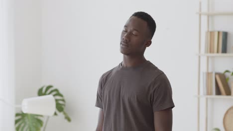 man meditating at home