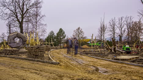 local concrete contractor workers constructing pavement in a public park