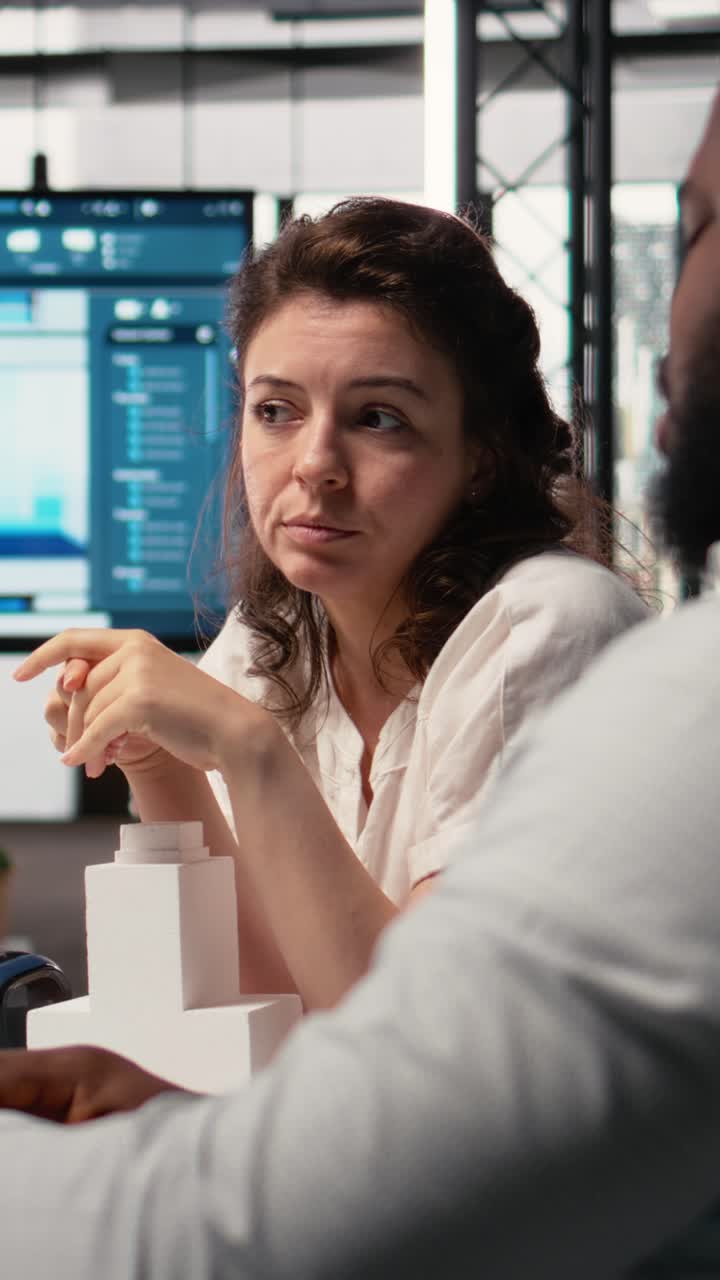 Vertical Video Diverse team of developers preparing property layouts and infrastructure designs