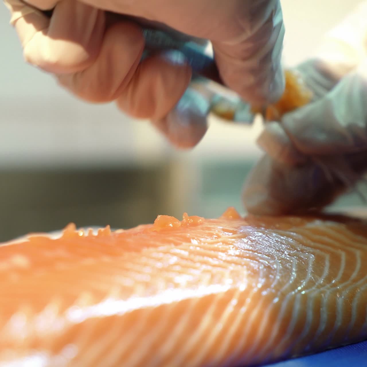 Chef cutting fresh salmon