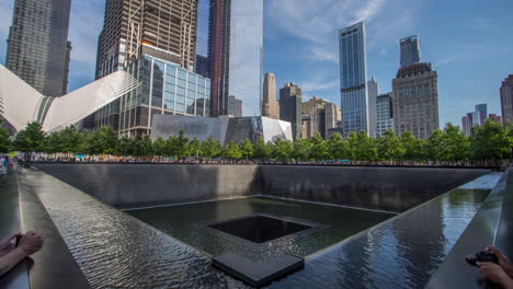 9/11 memorial pools and modern skyscrapers in new york city