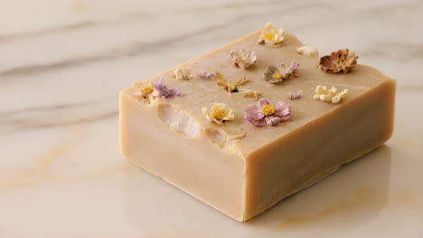 handmade floral soap bar on marble surface