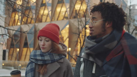 couple walking in city during winter