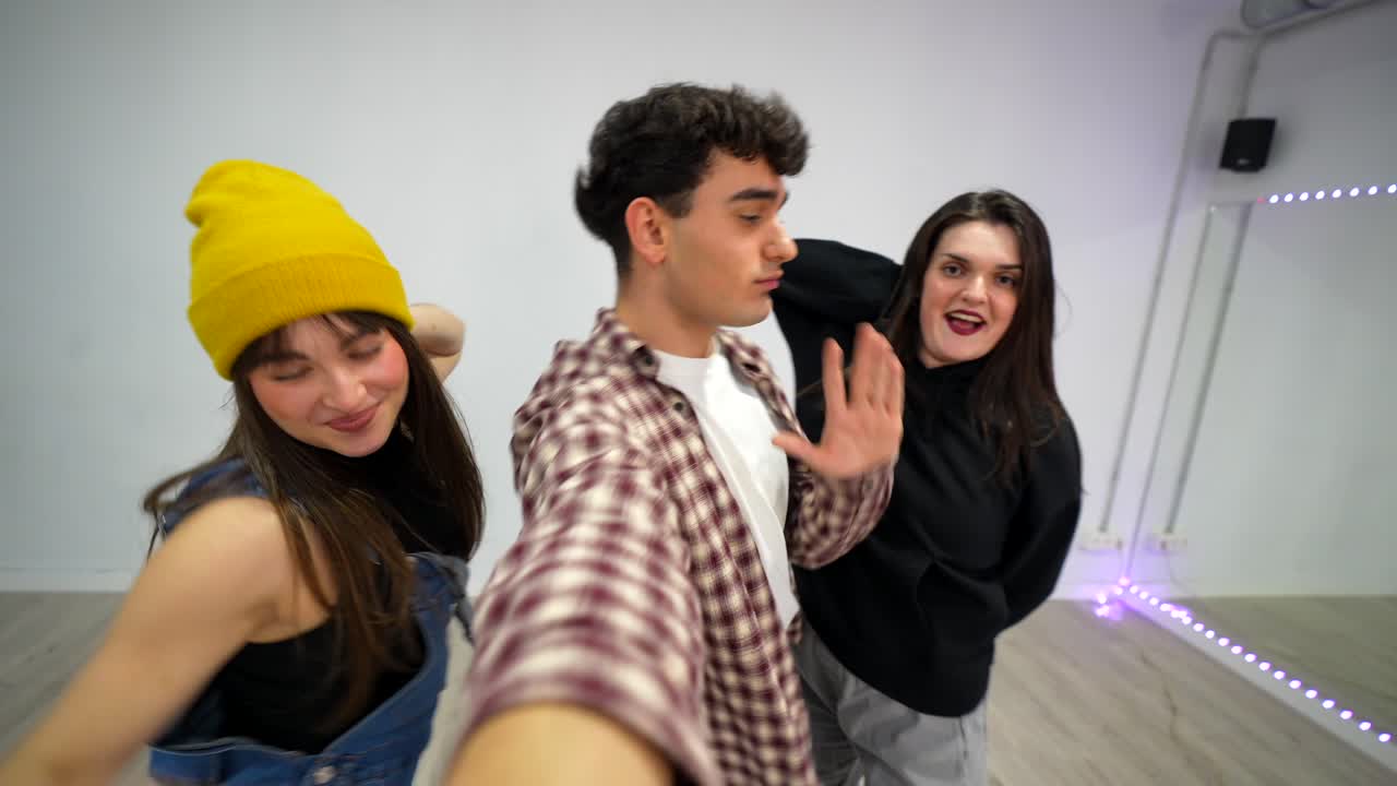 Group of friends dancing indoors