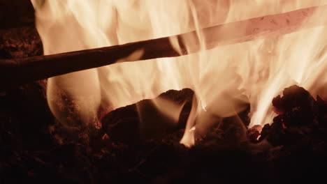 a red hot iron is inspected and returned to the fire for extra heating
