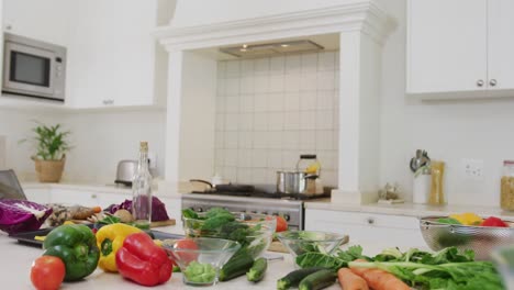 general view of kitchen with vegetables on countertop