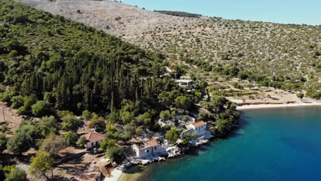 flying towards vintage houses along the agia sofia beach shoreline in kefalonia, greece