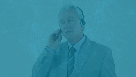 animation of network of connections over caucasian senior businessman talking on phone headset