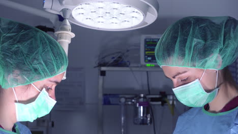 women performing surgery in hospital together