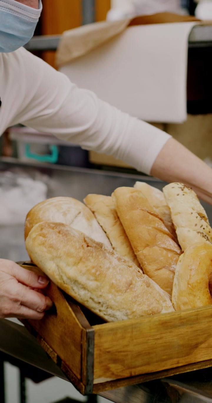 Bakery Staff Checking Inventory and Organizing Fresh Bread