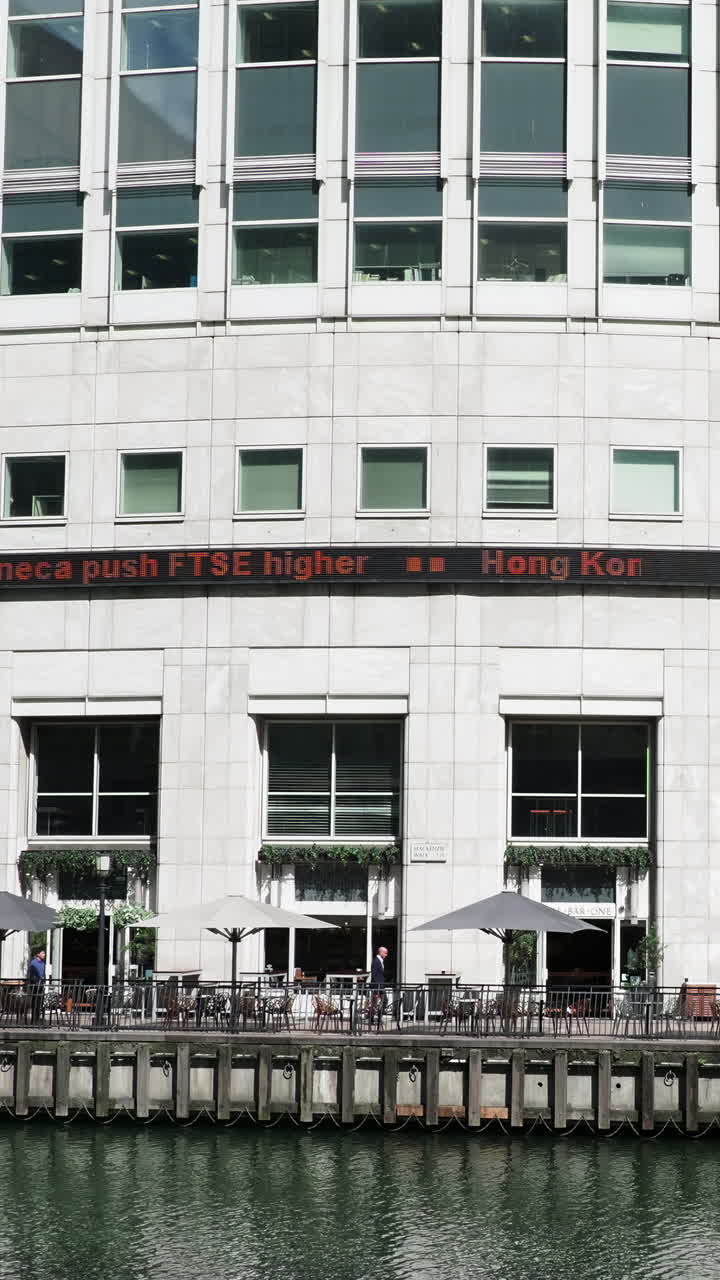 canary wharf in london, POV shot from the moving docklands light railway in vertical