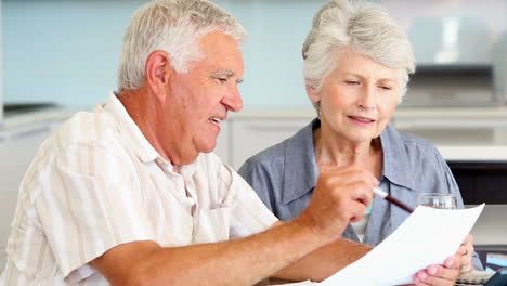 senior couple paying their bills