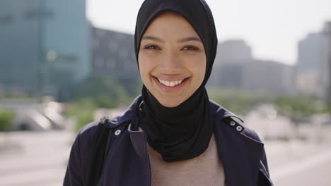 slow-motion-portrait-of-happy-mixed-race-muslim-business-woman-laughing-looking-at-camera-enjoying-sunny-urban-city-lifestyle