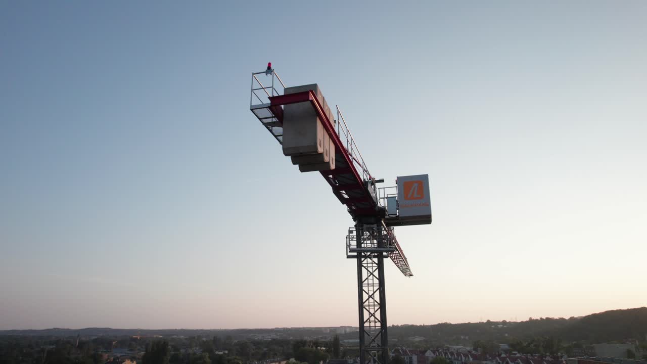 Big tower crane with counterweights at construction site in city. Real estate development