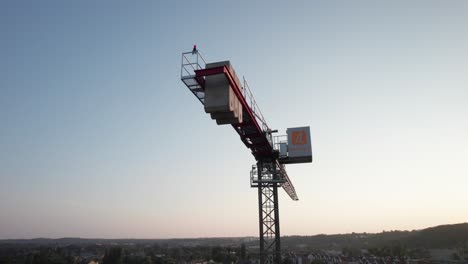 big tower crane with counterweights at construction site in city. real estate development