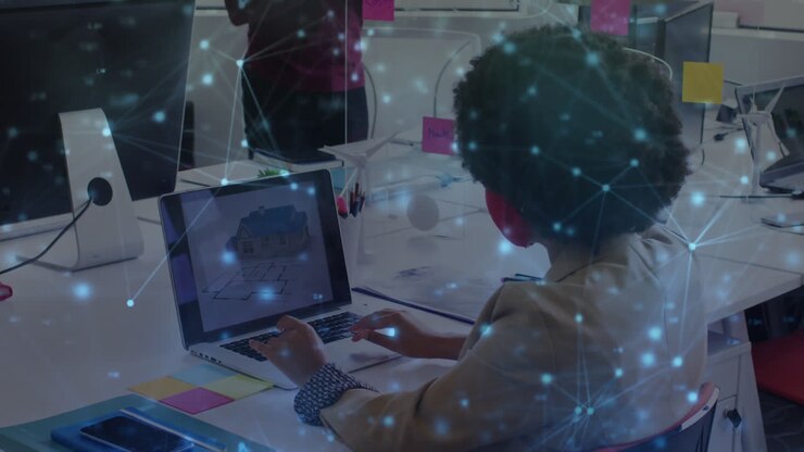 Animation of network of connections over african american businesswoman using laptop