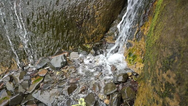 Waterfall at Hug Point at the Oregon Coast, State Park near Cannon Beach