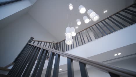 interior design stylish wooden stairs inside the house with modern wooden railings and walls decorated with trendy lamps. modern stairway or staircase inside in modern house interior