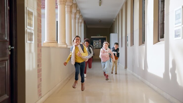 School, running and group of children in hallway