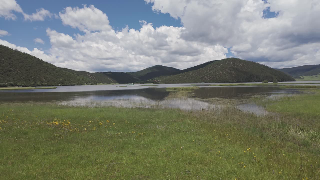 Potatso National Park, damp meadow and pristine lake on Tibetan Plateau, Yunnan, China