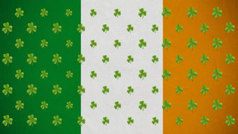 digital animation of multiple clover leaves moving against irish flag