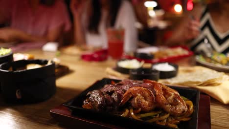 a vibrant restaurant scene with sizzling beef fajitas, colorful drinks, and a lively atmosphere captured in warm lighting