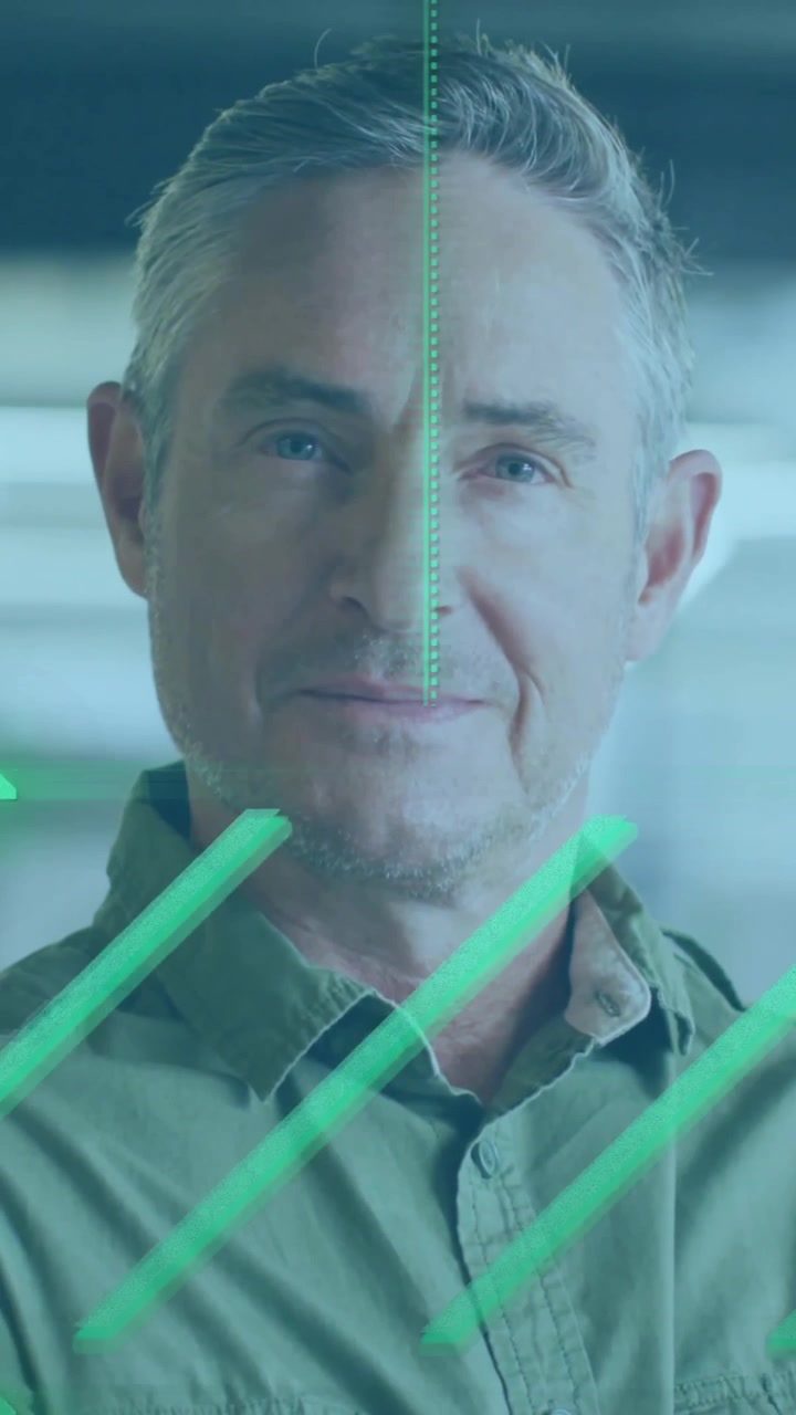 Green digital interface animation over man standing in modern office