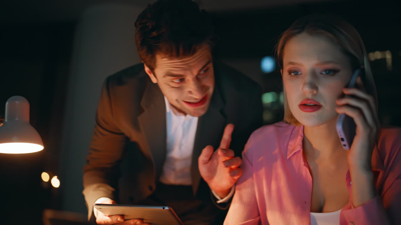 Business partners working late in the office