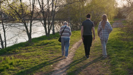 family walk in the park at sunset
