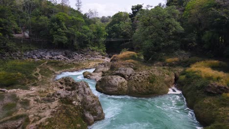 aerial: beautiful waterfall canyon in remote rainforest, natural wilderness