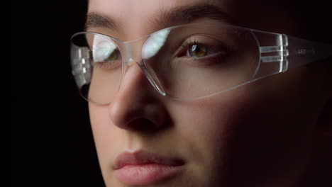 portrait of focused businesswoman reading through virtual reality glasses.