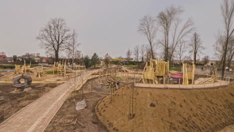 the construction of a play and sports field in a park from start to finish