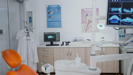 empty stomatology orthodontist office room with medical drill and dental teeth xray images