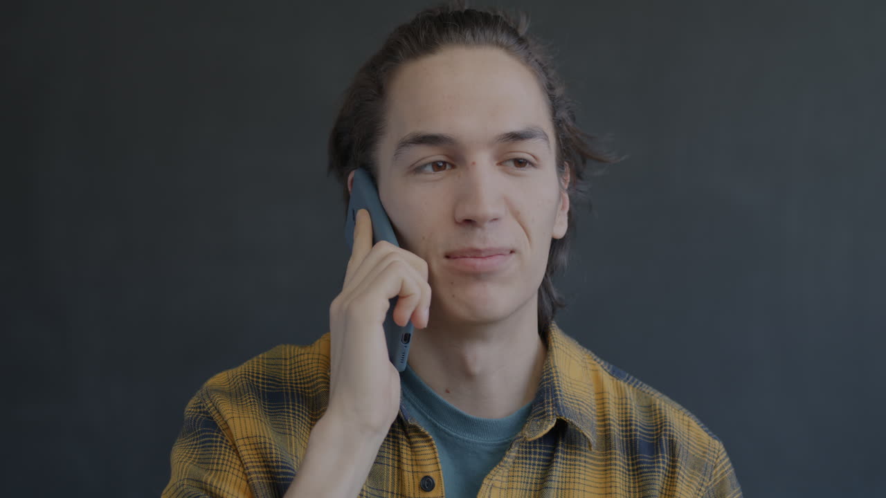 Young Man Talking on Phone