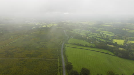 misty countryside landscape with road