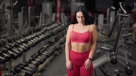 sports-girl-warms-up-in-the-gym