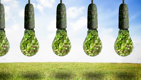 Animation-of-light-bulbs-full-of-plants-hanging-over-blue-sky-and-grass